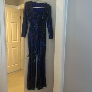 Nadine Merabi blue sequin jumpsuit with belt.